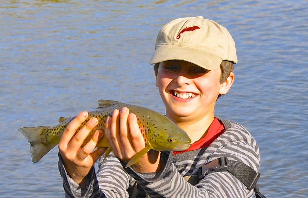 A boy never forgets his first catch.  Learn to fly fish in New Zealand with South Island fly fishing guides at Wild Angler.